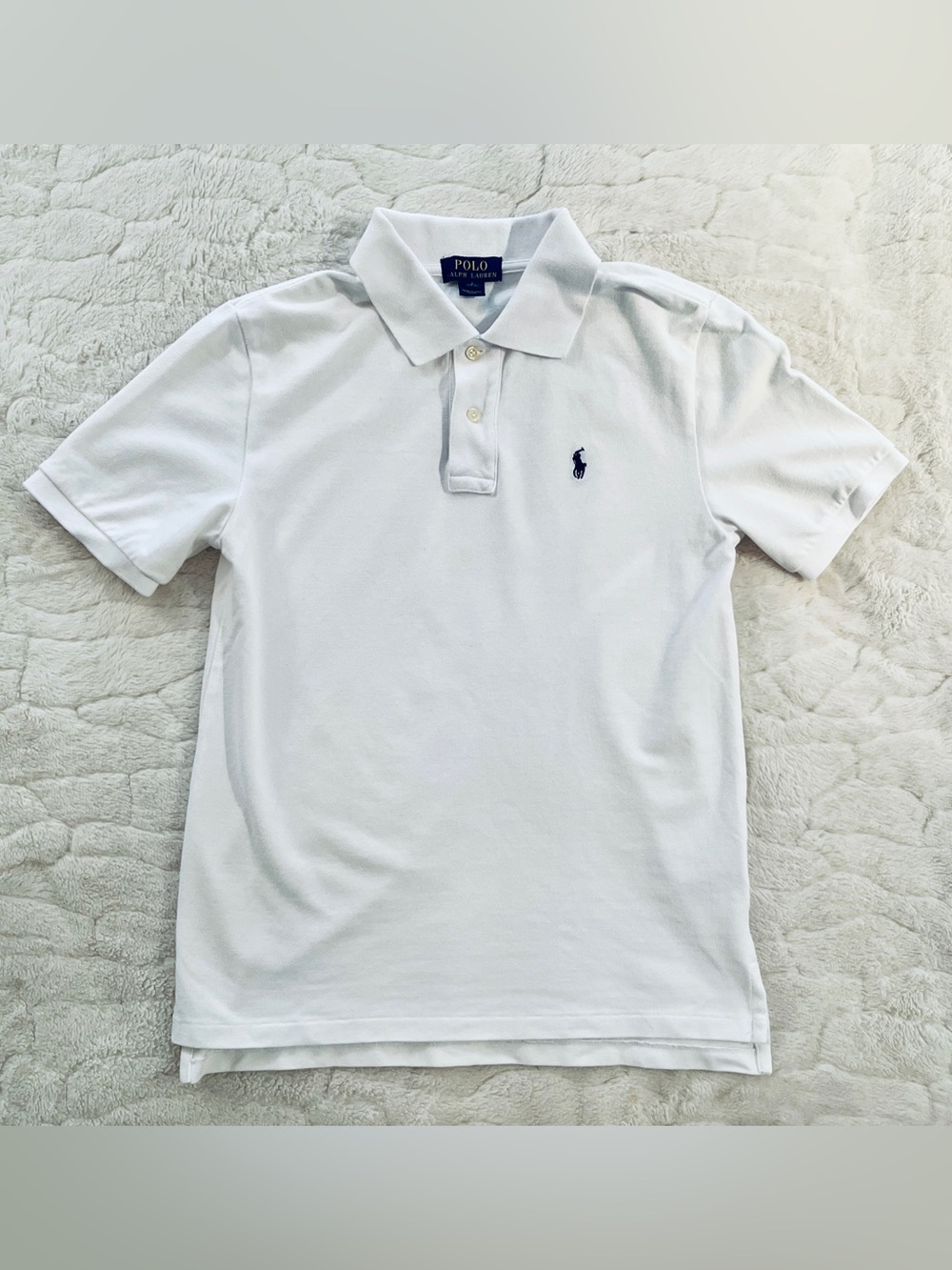 Polo Ralph Lauren polo shirt is white with a navy blue embroidered pony logo .L